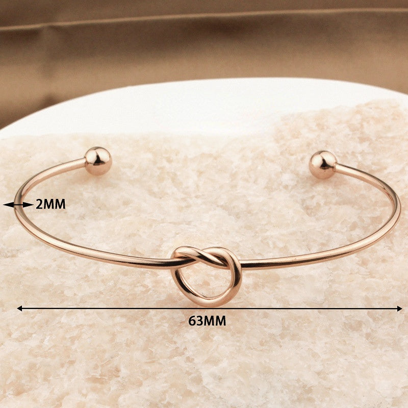 Pulsera De Acero De Titanio Con Corazón Anudado al por mayor